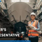 AN OWNER’S REPRESENTATIVE IN PPE REVIEWS DRAWINGS AND A TABLET IN A SUPERYACHT REFIT SHIPYARD