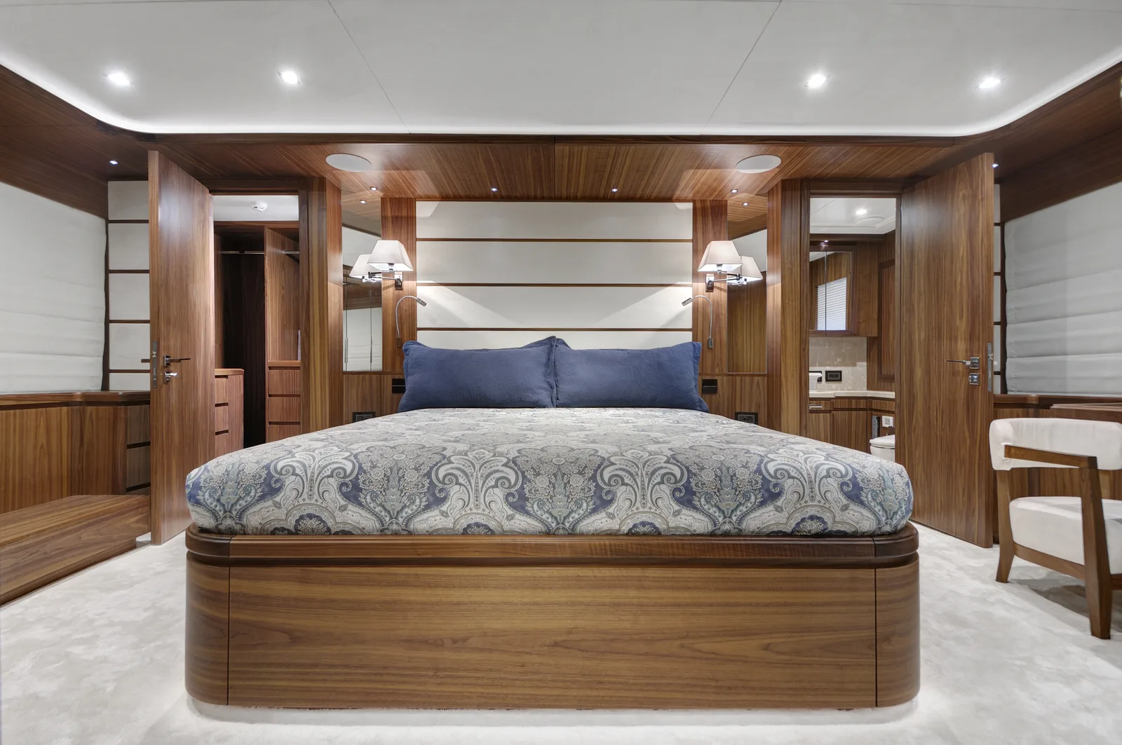 REFURBISHED MASTER CABIN WITH WALNUT JOINERY ON THE MOTOR YACHT CORONA AFTER HER REFIT AT KRM YACHT